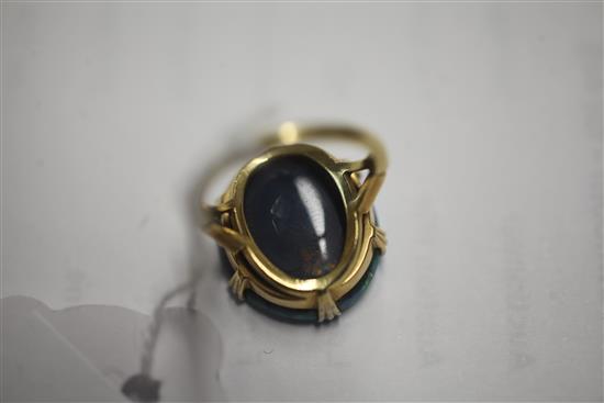 An 18ct gold and platinum set oval black opal dress ring, size L.